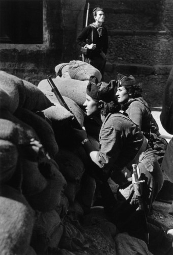 SPAIN. Spanish Civil War (1936-9)
Catalonia. Barcelona. August, 1936. Militiawomen defending a street barricade.
The Spanish Civil War broke out in 1936, when part of the Spanish army rebelled against the Second Republic, a democratic government elected in 1931. It gained international dimensions when Fascist Germany and Italy began supporting the military uprising, led by General Franco, with weapons and soldiers. The USSR helped the Republic, and a significant contingent of volunteers joined the International Brigades and fought for the Republic. The conflict became the symbol of a larger conflict between Fascists and Communists. The war ended in 1939 with Franco's victory over the Republicans.