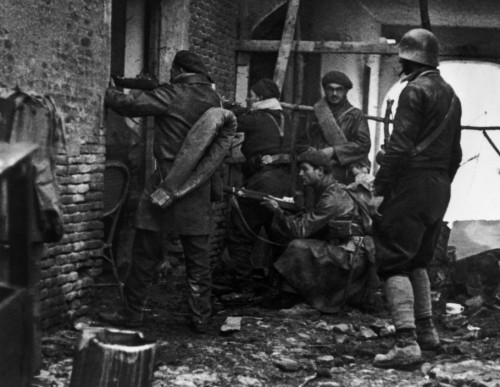 SPAIN. Spanish Civil War (1936-9).
Madrid. November/December, 1936. Members of the International Brigades engaged in a house to house battle around the slaughterhouse, near the university campus, in the western outskirts of the capital. The Fascist rebels were mounting a major offense in order to capture Madrid.The Spanish Civil War broke out in 1936, when part of the Spanish army rebelled against the Second Republic, a democratic government elected in 1931. It gained international dimensions when Fascist Germany and Italy began supporting the military uprising, led by General Franco, with weapons and soldiers. The USSR helped the Republic, and a significant contingent of volunteers joined the International Brigades and fought for the Republic. The conflict became the symbol of a larger conflict between Fascists and Communists. The war ended in 1939 with Franco's victory over the Republicans.