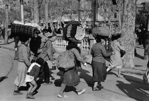 ICP 287 Barcelona. January, 1939. Evacuating the city which was being heavily bombed by fascist planes, as General Franco's fascist troops rapidly approached the city.
The Spanish Civil War broke out in 1936, when part of the Spanish army rebelled against the Second Republic, a democratic government elected in 1931. It gained international dimensions when Fascist Germany and Italy began supporting the military uprising, led by General Franco, with weapons and soldiers. The USSR helped the Republic, and a significant contingent of volunteers joined the International Brigades and fought for the Republic. The conflict became the symbol of a larger conflict between Fascists and Communists. The war ended in 1939 with Franco's victory over the Republicans.