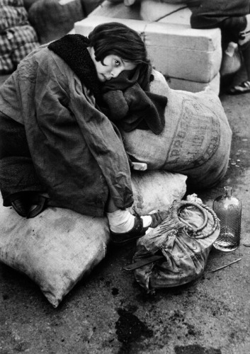 SPAIN. Barcelona. January 1939. Little girl resting during the evacuation of the city.