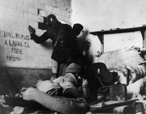 SPAIN. Spanish Civil War (1936-9).
Madrid. November/December, 1936. Members of the International Brigades, engaged in a house to house fight around the slaughterhouse, near the university campus, in the western outskirts of the capital. The Fascist rebels were mounting a major offense in order to capture Madrid.The Spanish Civil War broke out in 1936, when part of the Spanish army rebelled against the Second Republic, a democratic government elected in 1931. It gained international dimensions when Fascist Germany and Italy began supporting the military uprising, led by General Franco, with weapons and soldiers. The USSR helped the Republic, and a significant contingent of volunteers joined the International Brigades and fought for the Republic. The conflict became the symbol of a larger conflict between Fascists and Communists. The war ended in 1939 with Franco's victory over the Republicans.