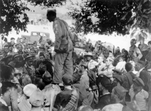 SPAIN. Spanish Civil War (1936-9). The Republican side. Andalusia. Cordoba front. September, 1936.
The Spanish Civil War broke out in 1936, when part of the Spanish army rebelled against the Second Republic, a democratic government elected in 1931. It gained international dimensions when Fascist Germany and Italy began supporting the military uprising, led by General Franco, with weapons and soldiers. The USSR helped the Republic, and a significant contingent of volunteers joined the International Brigades and fought for the Republic. The conflict became the symbol of a larger conflict between Fascists and Communists. The war ended in 1939 with Franco's victory over the Republicans.An officer addressing the soldiers before an attack.