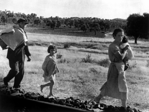 SPAIN. Spanish Civil War (1936-9)
Andalusia. Near Cerro Muriano. September 5th, 1936. Civilians fleeing a town bombed by Fascist planes.Réfugiés fuyants les franquistes. The Spanish Civil War broke out in 1936, when part of the Spanish army rebelled against the Second Republic, a democratic government elected in 1931. It gained international dimensions when Fascist Germany and Italy began supporting the military uprising, led by General Franco, with weapons and soldiers. The USSR helped the Republic, and a significant contingent of volunteers joined the International Brigades and fought for the Republic. The conflict became the symbol of a larger conflict between Fascists and Communists. The war ended in 1939 with Franco's victory over the Republicans.